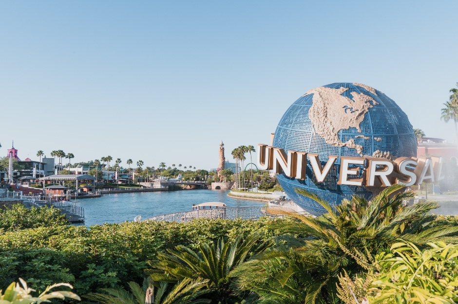 how to make dining reservations at universal orlando. This is an image of the spinning globe at Universal Orlando Resort with a view of the pond and surrounding areas of CityWalk.