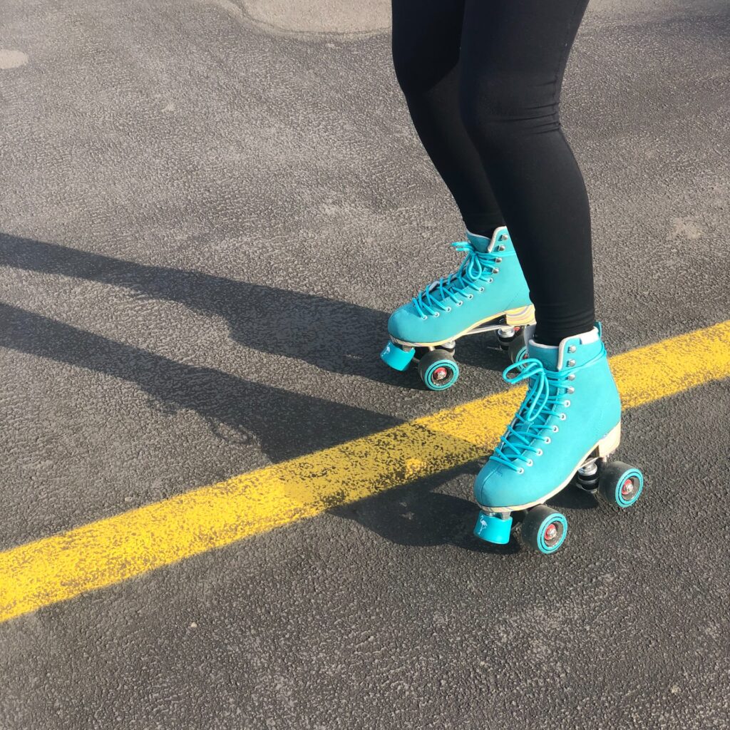 image of someone roller skating in a parking lot